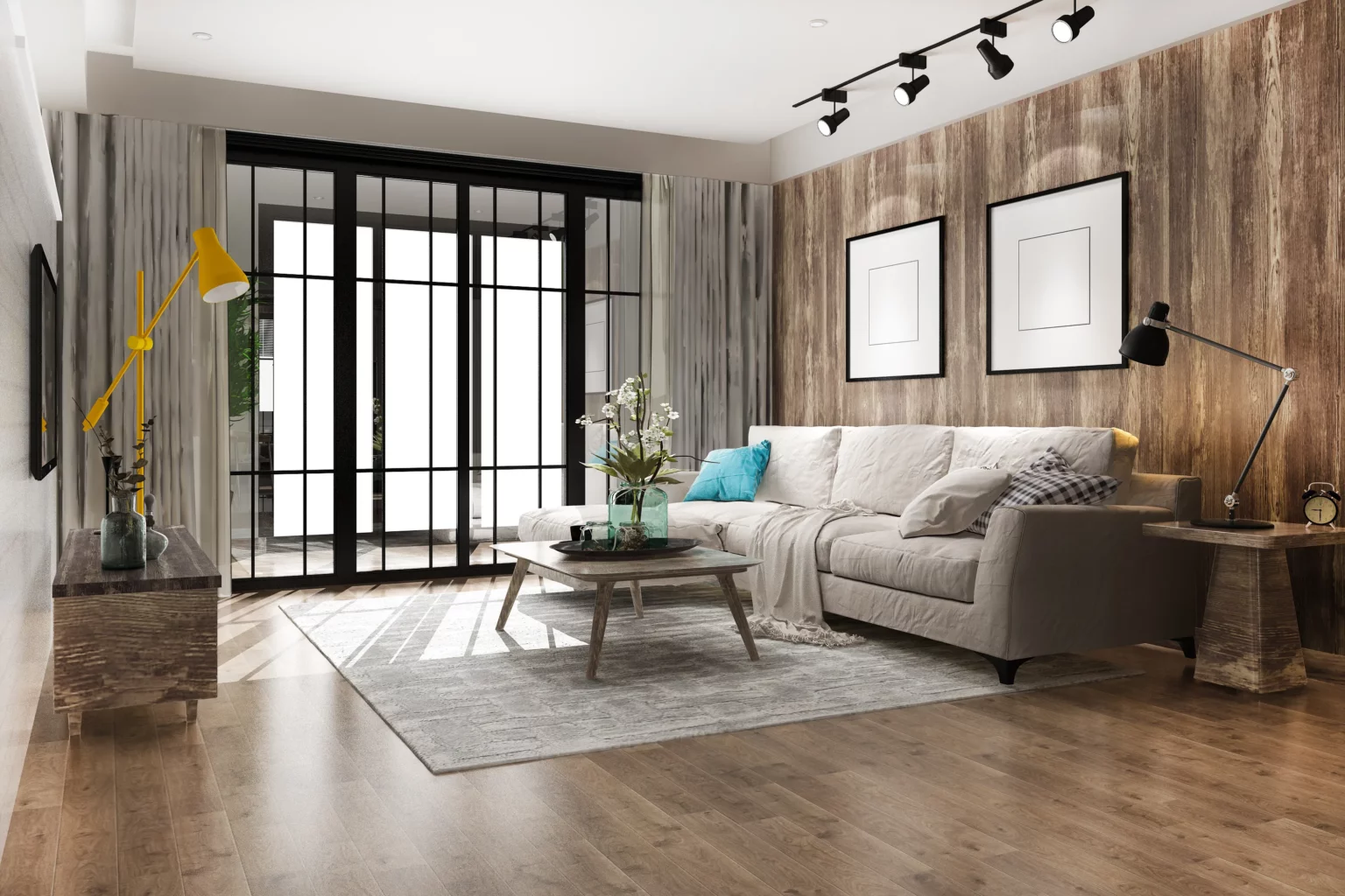 Das Bild zeigt ein modernes Wohnzimmer, in dem das zentrale Element ein graues Sofa ist. Die Wände sind mit Holz verkleidet und verleihen dem Raum eine warme Atmosphäre. Eine große Glastür führt nach draußen und lässt viel natürliches Licht herein. Zur Beleuchtung dienen eine gelbe Stehlampe sowie eine schwarze Tischlampe, die auf einem seitlich platzierten Möbelstück steht. Vor dem Sofa befindet sich ein Couchtisch, der mit einer Vase voller Blumen dekoriert ist. Ein grauer Teppich liegt auf dem Boden und sorgt für zusätzliches Komfortgefühl im Raum. An den Wänden hängen gerahmte Schwarz-Weiß-Bilder, die einen stilvollen Akzent setzen. Der Gesamteindruck des Wohnzimmers ist modern und gemütlich, ideal zum Entspannen oder für Gästeempfang geeignet.
