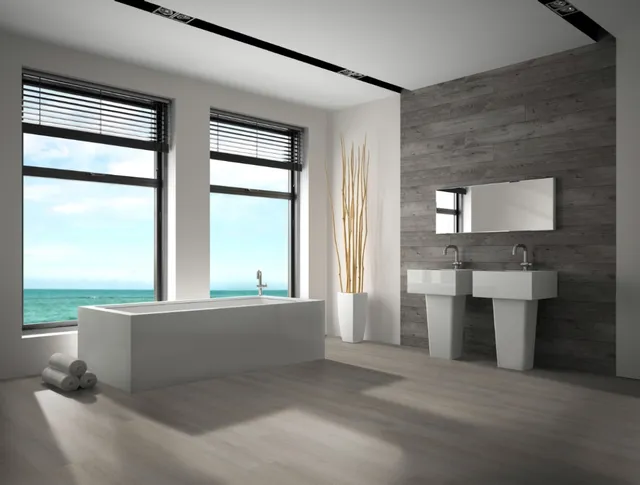 Badezimmer mit hellem Hartvinylboden, großen Fenstern, Doppelwaschbecken und Meerblick.