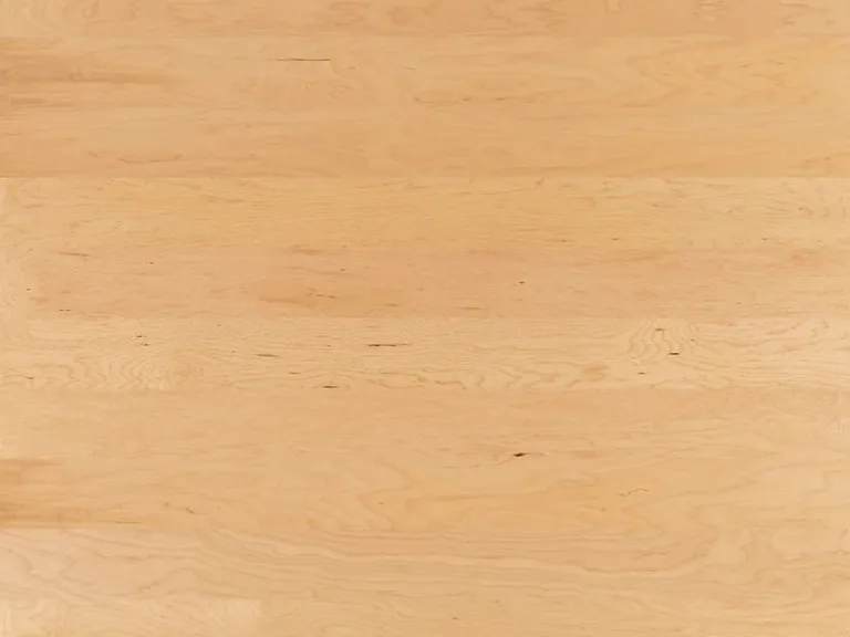 Helle Holzoberfläche mit einheitlichem, hellbeigem Finish, geeignet für moderne Innentüren.