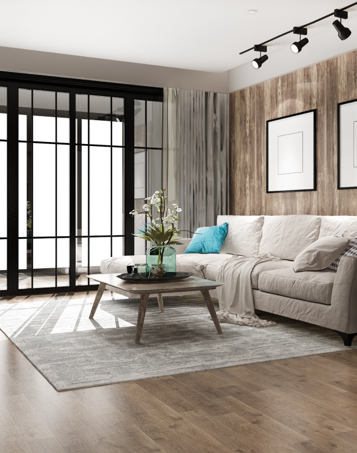 Wohnzimmer mit beigem Sofa, Holzpaneelwand und hellem Bodenbelag für Arbeitsräume.